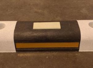 Reflective bike lane separator