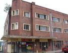 Apartment block with retail space