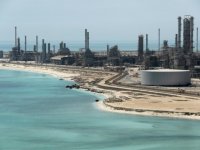 Saudi Aramco aims to buy controlling stake in SABIC: sources